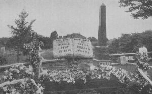 The burial site of James and Ellen White with prominent obelisk tombstone.