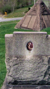 Founder Jehovah's Witnesses, Charles Russell's burial pyramid.  Featuring cross and crown emblem similar to the Christian Science church emblem, Jehovah's Witness egravement.